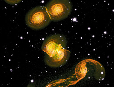 Darstellung von zwei Modellspiralgalaxien in verschiedenen Stadien einer Kollision. [ …