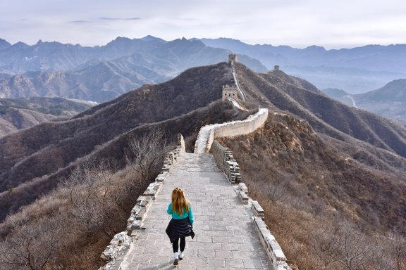 Student walks on top of the Chinese Wall