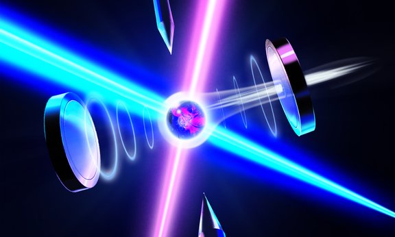 Ein Gerät strahlt einen blauen und pinken Laserstrahl aus