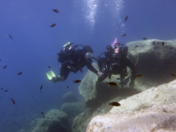 two divers in the calvi bay