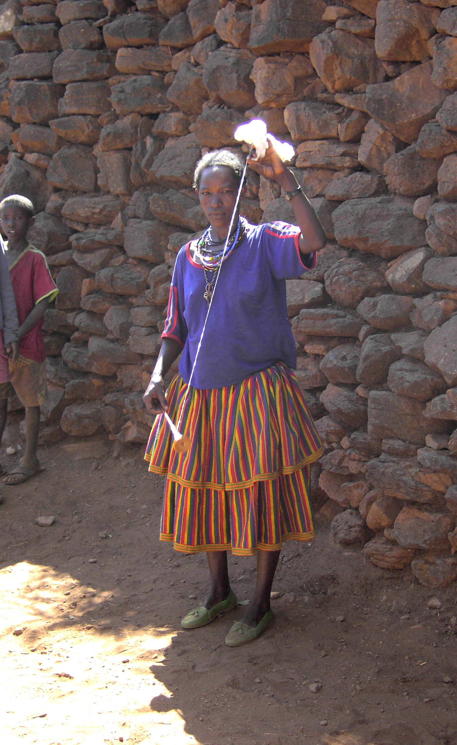 Ethiopia, Konso woman spinning