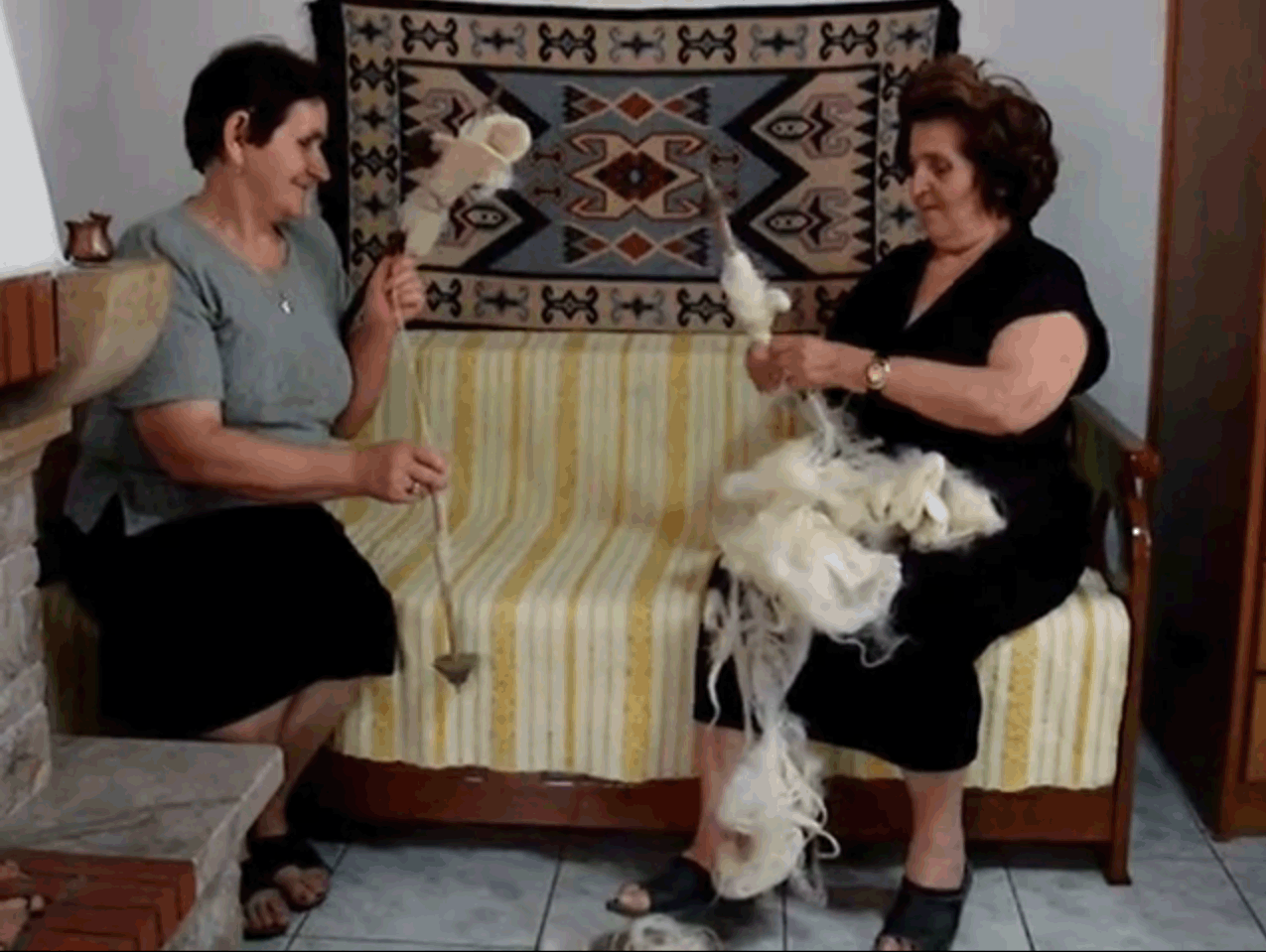 2 Greek women spinning