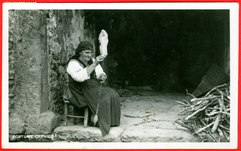 Italy, Friuli, woman spinning with drop spindle