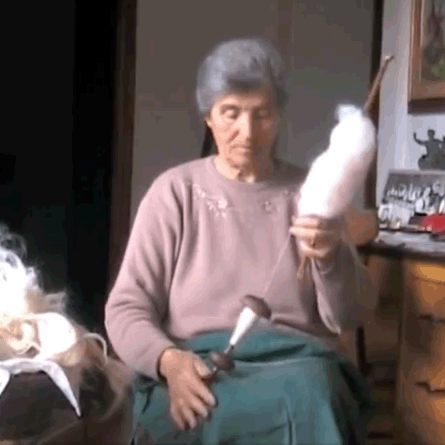 Italy, Sardinia, woman spinning