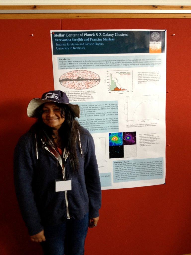 Sreevarsha before her poster with her Tyrolian hat-prize
