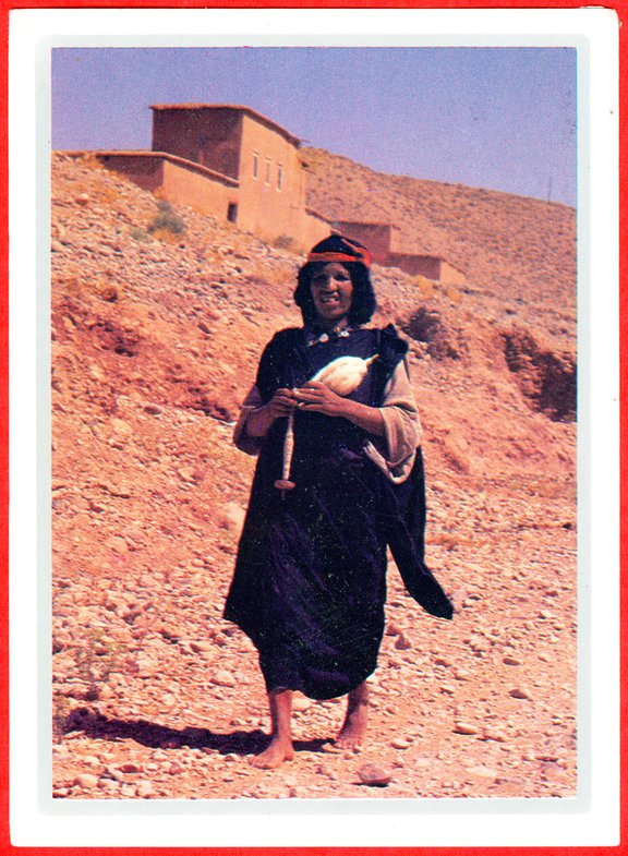 Morocco, spinner with spindle and distaff