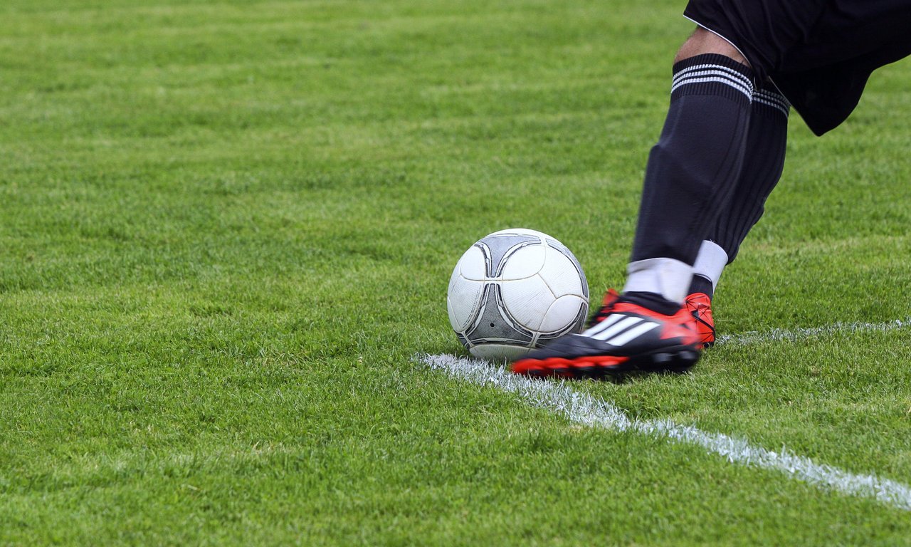 Football and a footballer's leg.