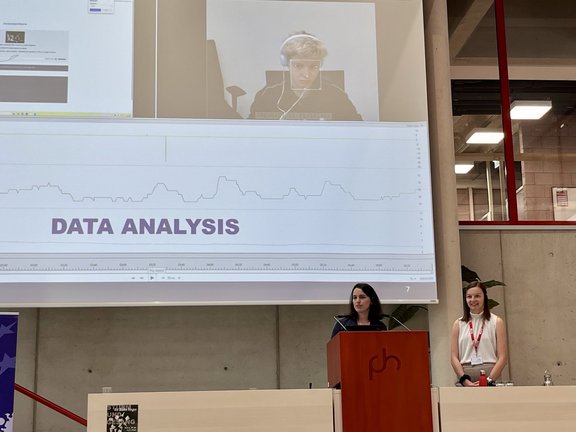 Elisa Guggenbichler & Simone Baumgartinger in front of screen at EALTA 2025