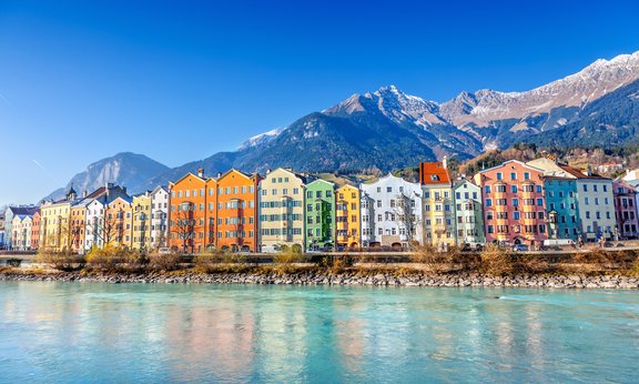 Innsbruck cityscape: river Inn, colourful houses, mountains