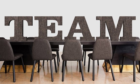 Chairs and the word "Team" in big letters