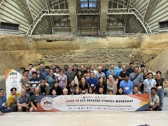 Land-to-Sea Shaking Studies workshop participants in a trench across the Chelungpu Fault at the Fault Preservation Park Museum.