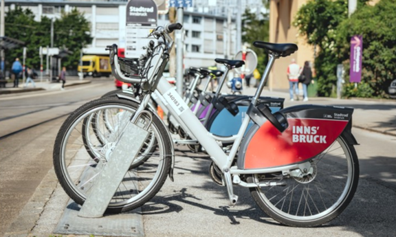 Citybikes parked at a rental station in Innsbruck