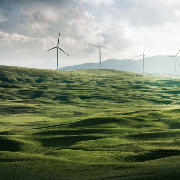 Windmills and green hills
