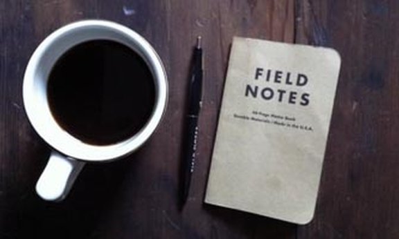 Coffee cup and a notebook