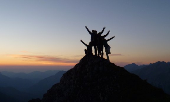 People Standing on the top of a mountain