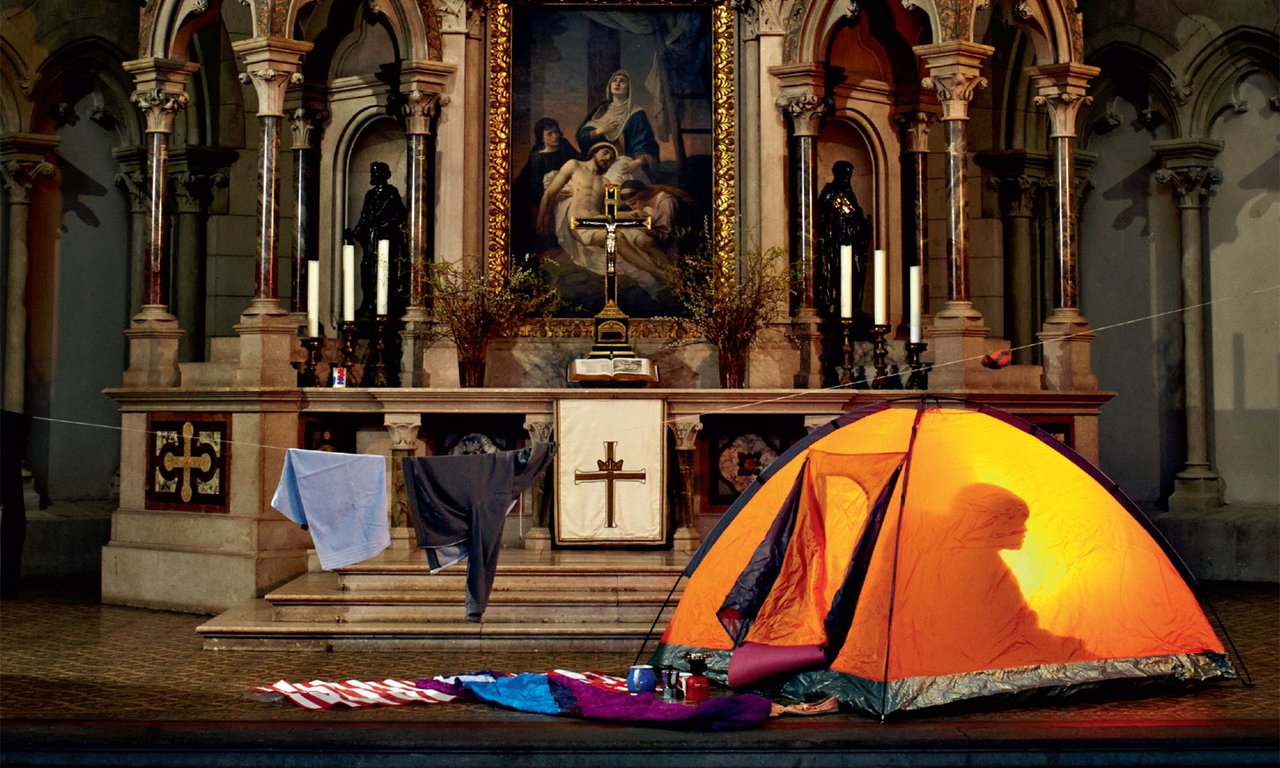 Illuminated tent in a church