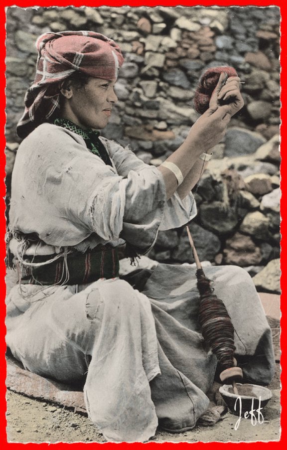 Morocco, High Atlas, Woman spinning wool