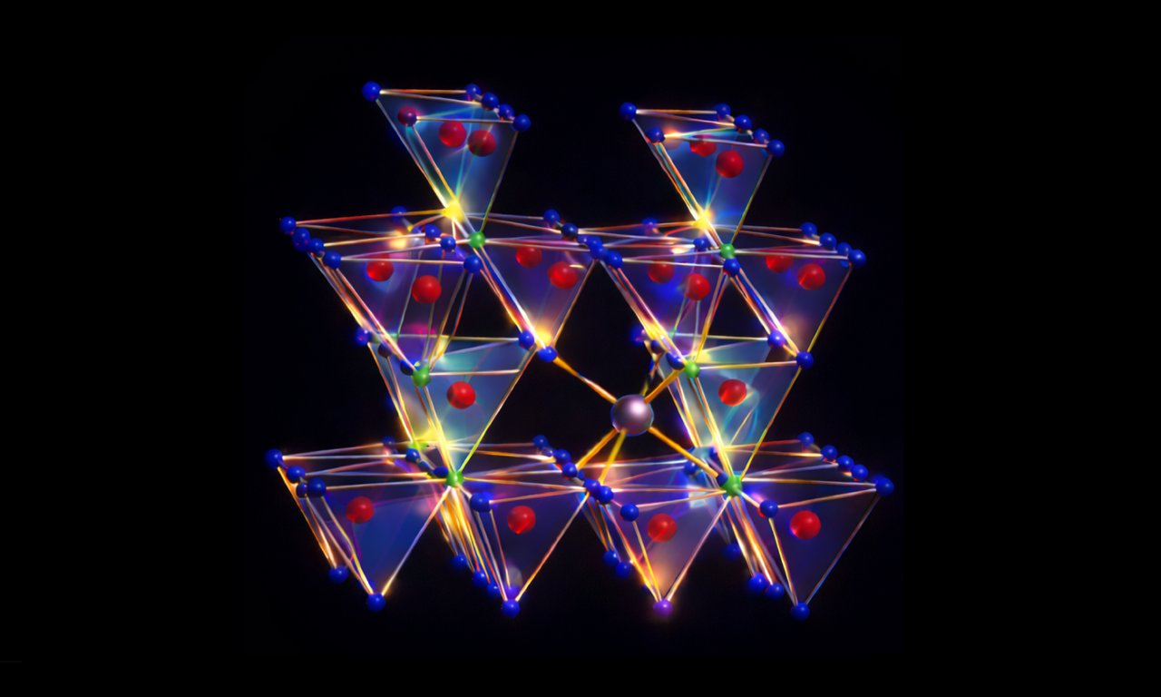 Abstract 3D representation of a crystalline structure consisting of several interconnected, transparent polyhedrons. The bodies are tetrahedral or octahedral in shape, with bright edges in yellow, blue, and orange.