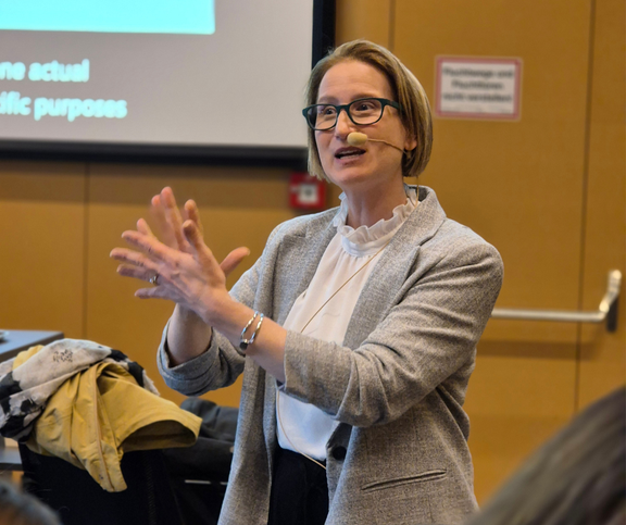 Paula Winke presenting in front of screen