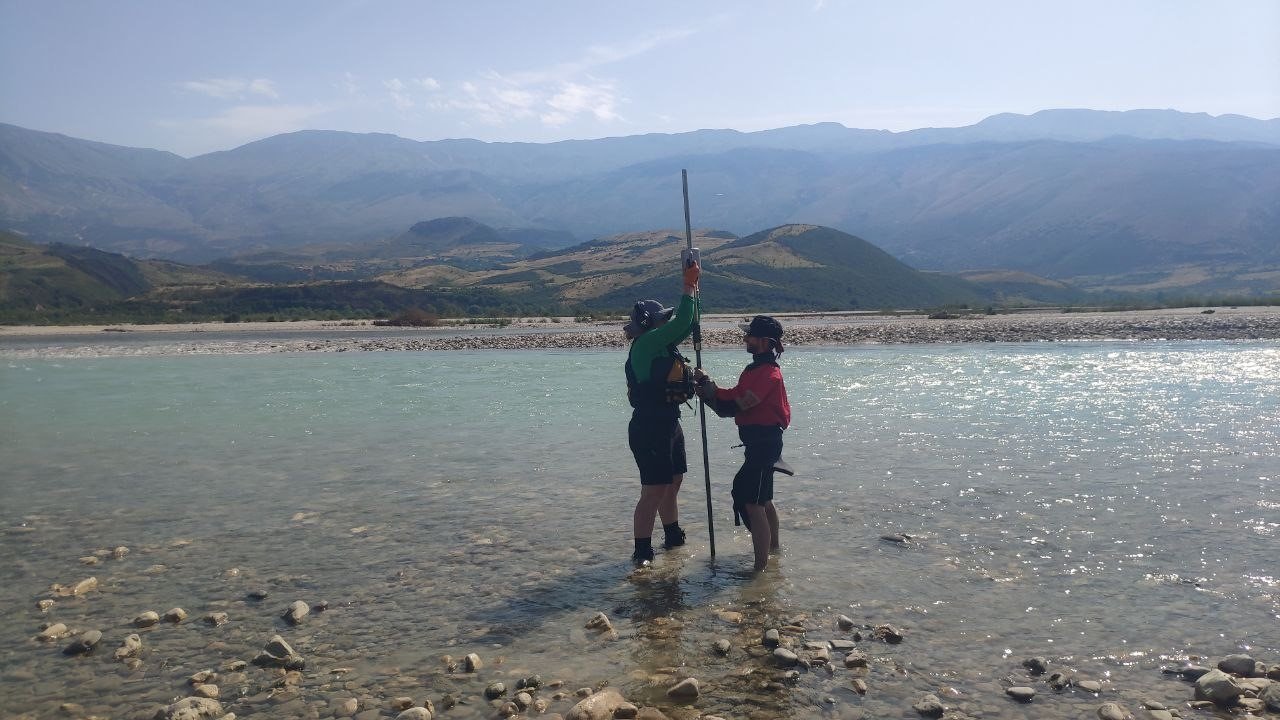 Hammering in piezometers (plastic tubes with holes at the bottom) to take samples from the hyporheic zone during my master thesis at the Vjosa River (Albania)