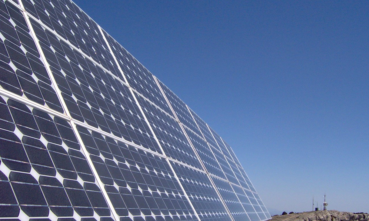 Solar panels under blue skies