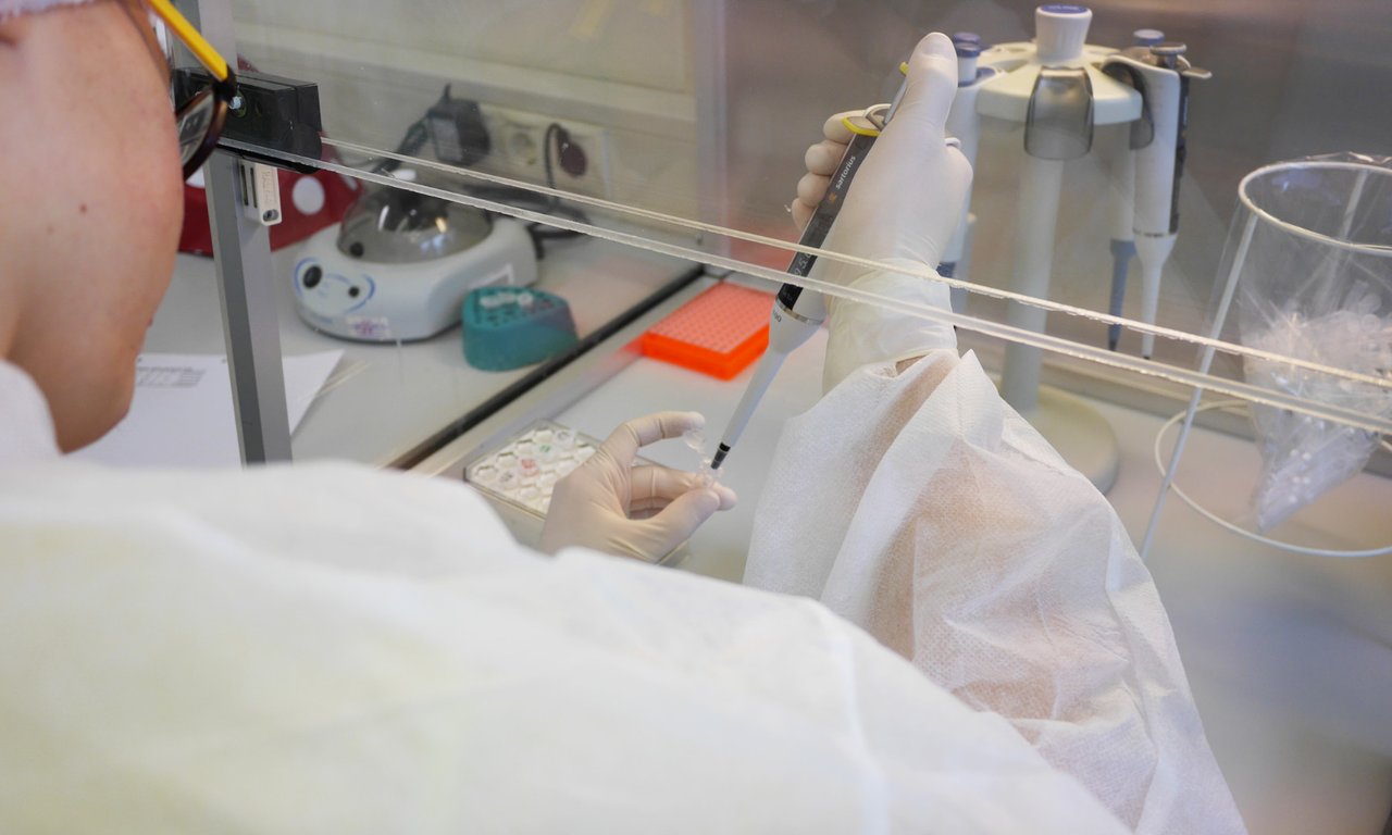 Scientist with a pipette
