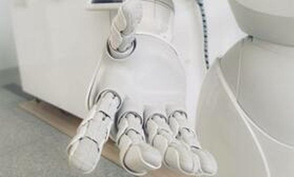 Weiße Roboterhand.