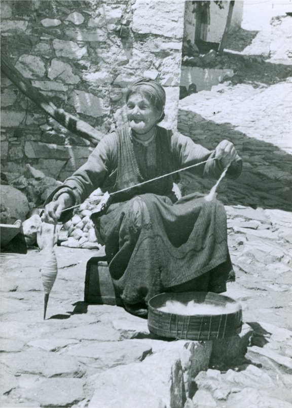 Greece, Thasos, woman spinning