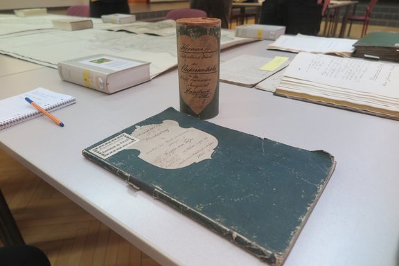 Worn book, which is the manuscript of a historical map.