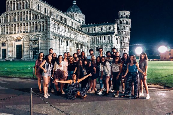 Group of students in Pisa at night