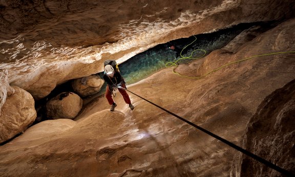 Kathleen Wendt rappels down to the narrow lower chamber in Devils Hole 2 cave.