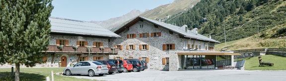 Universitätszentrum Obergurgl houses with forest in background