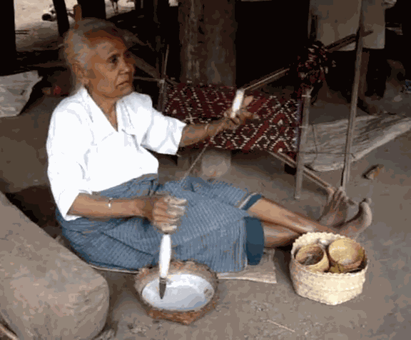 Timor, woman spinning cotton