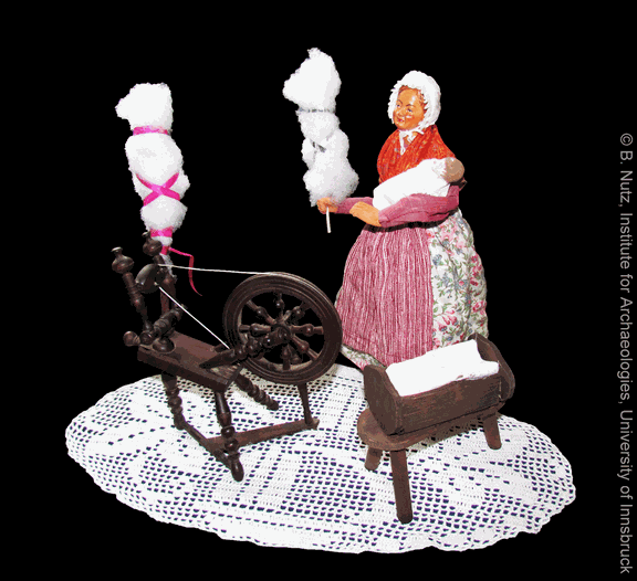 Spinnerin mit Spinnrad