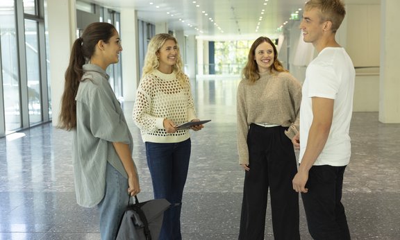 People standing in the faculty building.